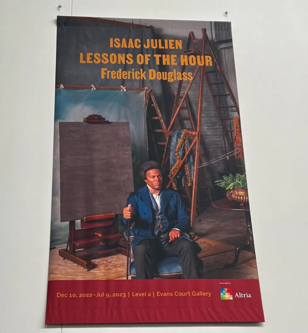 Poster of Issac Julien on a white wall